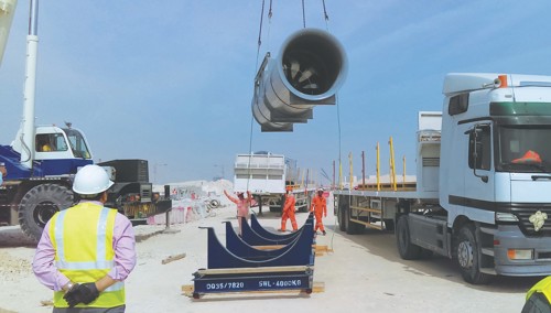 A large Woods Air Movement axial jet fan being lifted by a crane from the pallet it was delivered on 
