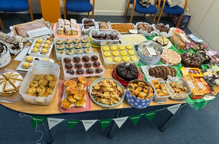 Table loaded with cakes and bakes