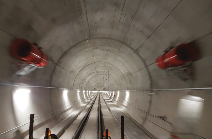 Rail tunnel with two red fans