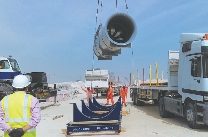 Tunnel fan being unloaded by crane